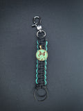 black w/teal paracord keychain with butterfly pendant