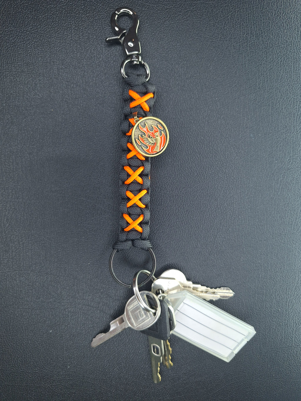 Black/orange paracord Keychain with dove with flames