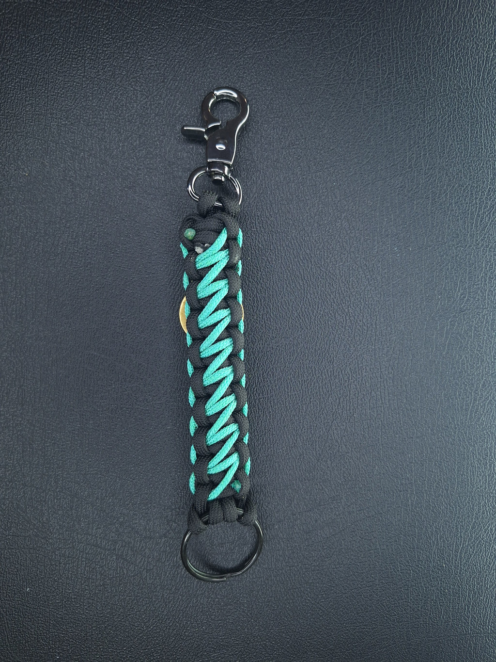 black w/teal paracord keychain with butterfly pendant
